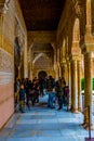 GRANADA, SPAIN, JANUARY 3, 2016: people are enjoying view of the court of lions inside of the alhambra palace in spanish