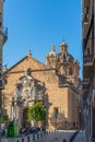 Granada, Spain - January 6, 2020: View of the building of the Basilica of Saints Justus and Pastor with street view, Andalusia. Royalty Free Stock Photo