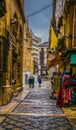 GRANADA, SPAIN, JANUARY 3, 2016: view of a street in the historical city center of spanish city granada during a rainy Royalty Free Stock Photo