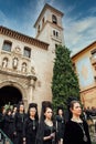 Granada, Spain, March 26, 2013. Women dressed in black dress and mantilla during holy week. Royalty Free Stock Photo