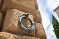 Decorative Metal Ring with Eagle head on the facade of Palace of Charles V at Alhambra - Granada, Andalusia, Spain