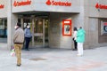 GRANADA, SPAIN, 23RD APRIL, 2020 People waiting in line at the bank protected by masks.