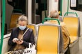 GRANADA, SPAIN, 23RD APRIL, 2020 People wearing mask in the train during the Covid-19 pandemic Royalty Free Stock Photo