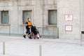 GRANADA SPAIN 23RD APRIL 2020. Sanitary man taking an elderly woman in a wheelchair to the hospital