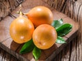 Granadilla fruits on a wooden table.