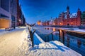 The granaries island over Motlawa river at snowy dawn, Gdansk. Poland