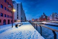 The granaries island over Motlawa river at snowy dawn, Gdansk. Poland