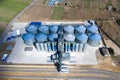 Granary elevator. Silver silos on agro-processing and manufacturing plant for processing drying cleaning