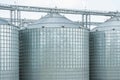 Granary. A large modern agro-processing plant for the storage and processing of grain crops. Large metal barrels of grain