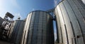 Granary. Tanks for processing and storage of soybean and wheat grains. Royalty Free Stock Photo