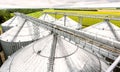Grain elevator silos closeup with blue sky on the background Royalty Free Stock Photo