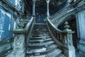 Grand Abandoned Mansion Interior with Elegant Staircase and Vintage Architectural Details Royalty Free Stock Photo