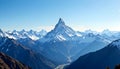 Grand Alpine Peak Surrounded by Endless Snowy Ridges Royalty Free Stock Photo