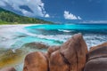 Grand Anse at La Digue island in Seychelles. Long exotic paradise like beach with blue lagoon and white waves