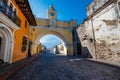 Grand archway in the middle of a cobblestone street in Antigua, Guatemala Royalty Free Stock Photo