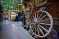 In the Grand Bazaar in Xinjiang, China, the wooden wheels of the early horse carriages are displayed