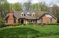 Grand Brick Home with Landscaped Lawn Royalty Free Stock Photo