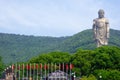 Grand Buddha statue at Lingshan with flags in the front