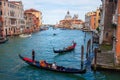 Grand canal and Basilica Santa Maria della Salute, Venice, Italy. Beautiful view on gondolas, boats in Grand canal Royalty Free Stock Photo