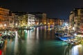 The Grand Canal and boat traffic at night from the Rialto Bridge in Venice in Veneto, Italy Royalty Free Stock Photo