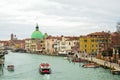 Grand canal with boats and the reflection of the old colourful houses in the water, Venice, Italy Royalty Free Stock Photo