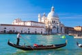 Grand Canal with gondola against Basilica Santa Maria della Salute in Venice, Italy Royalty Free Stock Photo