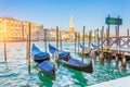 Grand Canal Gondolas at the pier - gondola customs service and San Giorgio Maggiore church Royalty Free Stock Photo