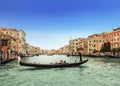 The Grand canal and gondolas with tourists, Venice