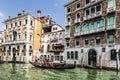 The Grand canal and gondolas with tourists, Venice,