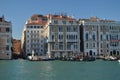 Grand Canal With Gondolas Walking To Tourists Background A Picturesque Venetian Palaces In Venice. Travel, holidays, architecture