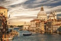 Grand Canal overlooking the Cathedral of Santa Maria della Salute and gondola with tourists, Venice Royalty Free Stock Photo
