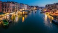 Grand Canal in Venice, Italy day to night timelapse. View on gondolas and city lights from Rialto Bridge. Royalty Free Stock Photo