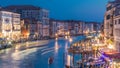 Grand Canal in Venice, Italy day to night timelapse. View on gondolas and city lights from Rialto Bridge. Royalty Free Stock Photo