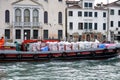 Photo of the service boat taken from the left side of the Grand canal in Venice, Italy.