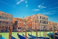 Grand Canal waterway in Venice with docked, moored and sailing gondolas boats, Palazzo Cavalli palace