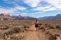 Grand Canyon - Backpacker woman on panoramic Bright Angel hiking trail on way to Plateau Point at South Rim, Arizona, USA Royalty Free Stock Photo