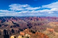 Grand canyon landscape from South rim viewpoint. Brlliant colors of the northern wall; blue sky and clouds overhead. Royalty Free Stock Photo