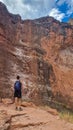 Grand Canyon - Man hiking along Bright Angel trail with panoramic aerial overlook of South Rim of Grand Canyon, Arizona, USA Royalty Free Stock Photo