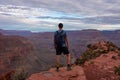 Grand Canyon - Man with panoramic aerial view from Ooh Ahh point on South Kaibab hiking trail at South Rim, Arizona, USA Royalty Free Stock Photo