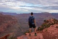 Grand Canyon - Man with panoramic aerial view from Ooh Ahh point on South Kaibab hiking trail at South Rim, Arizona, USA