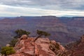 Grand Canyon - Woman with panoramic aerial view from Ooh Ahh point on South Kaibab hiking trail at South Rim, Arizona, USA