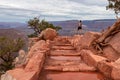 Grand Canyon - Woman with panoramic aerial view from Ooh Ahh point on South Kaibab hiking trail at South Rim, Arizona, USA