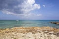 Grand Cayman Island Rocky Shore And A Boat Royalty Free Stock Photo