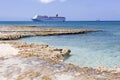 Grand Cayman Rocky Beach And A Cruise Ship Royalty Free Stock Photo