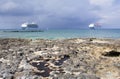 Grand Cayman Rocky Beach And Cruise Ships Royalty Free Stock Photo