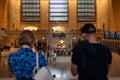 Grand Central Terminal Interior View seen between Two Tourists in New York City Royalty Free Stock Photo