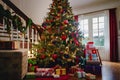 A grand Christmas tree towering in a spacious living room