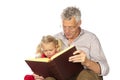 Grand-father read to his grand-child