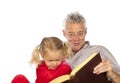 Grand-father read to his grand-child