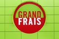 Grand Frais supermarket logo on a wall